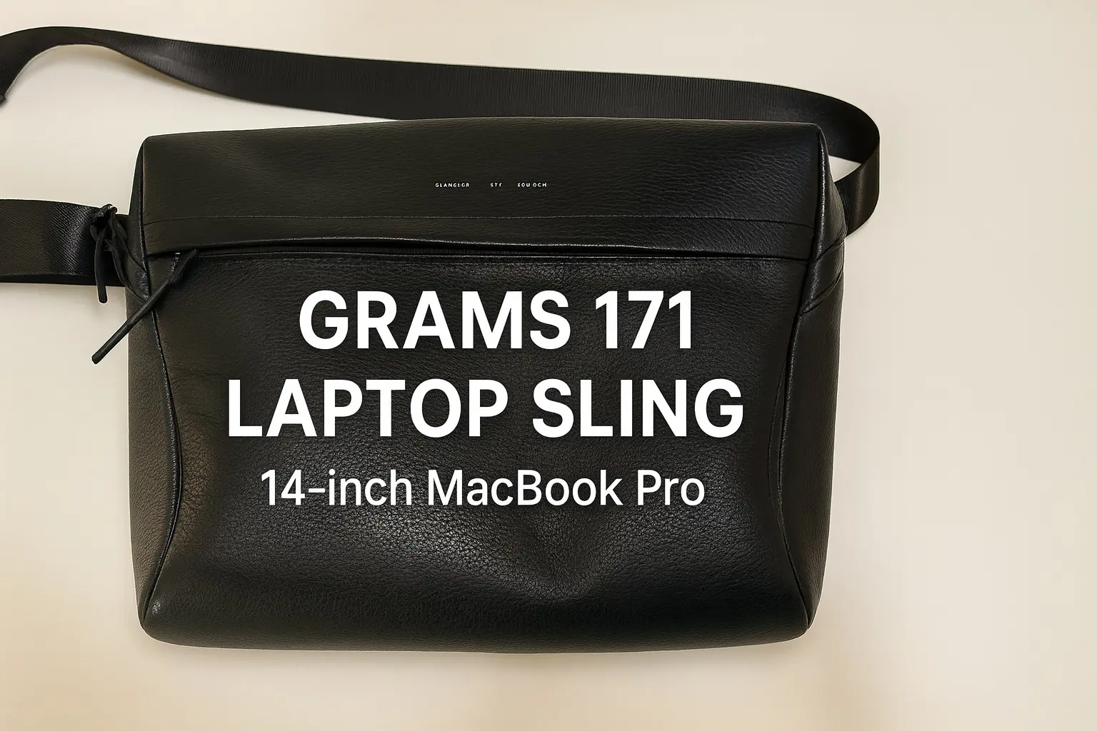 GRAMS28 171 Laptop Sling leather bag. A premium Italian leather sling bag that fits the 14-inch MacBook Pro, minimalist design with a stylish review article cover image.
